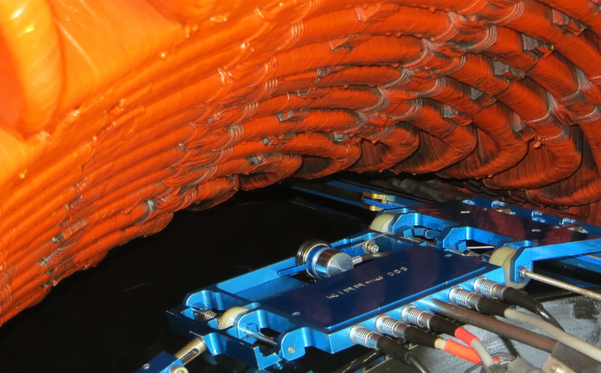 Mechanized inspection system positioned on a generator retaining ring